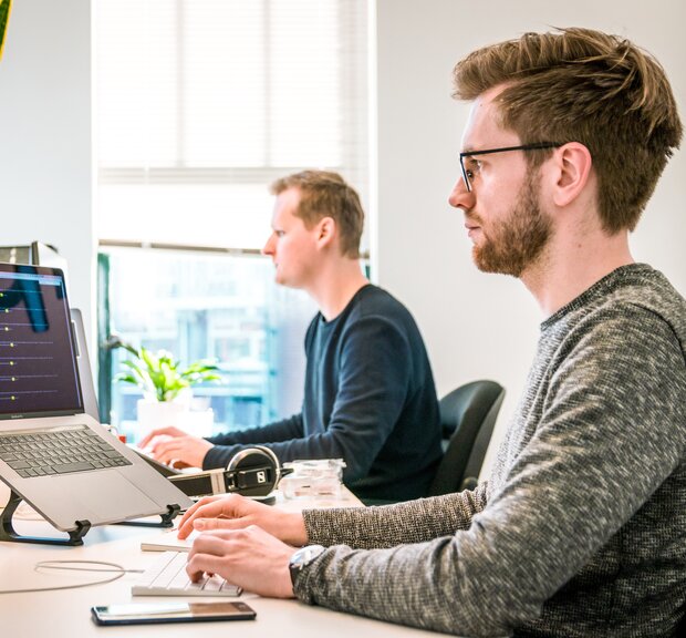 Software developers work on the laptops