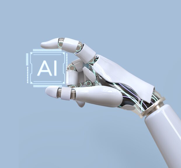 AI robot hand holding AI sign on blue background.